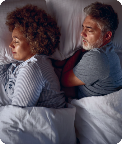 Couple sleeping with Raizz sleep and rest tracking